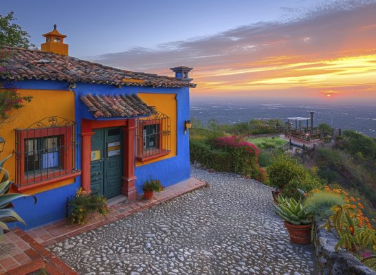 Side view of a traditional Mexican home with vivid colors and intricate details. The scene includes local wildlife and a vibrant sunset. Shot on 35mm film, realistic, high-resolution --chaos 12 --ar 8:5 --style raw --stylize 450 --v 6 Job ID: 316345e4-ea3c-4d98-b741-a4de1e676499